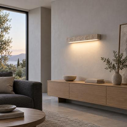 Slim travertine wall light installed in a modern sitting room, side view