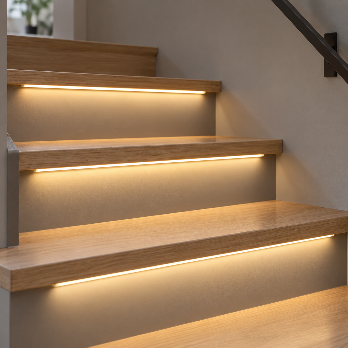 Warm light (3000K) COB LED stair strips installed under oak treads