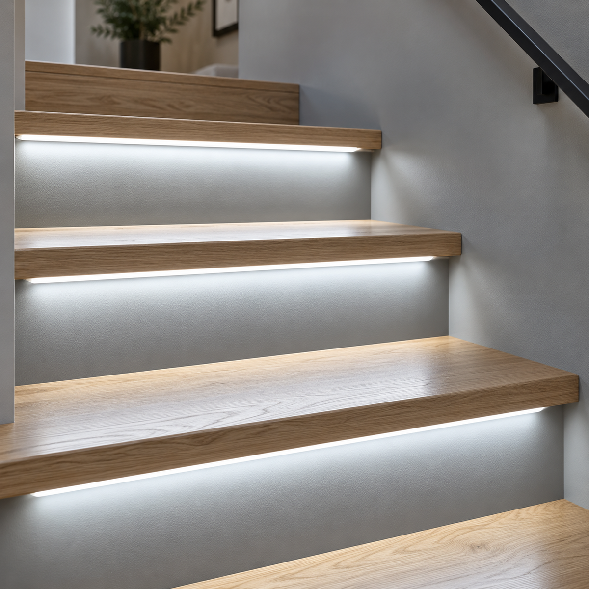Cold light (6000K) COB LED stair strips installed under oak treads