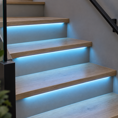 Cold blue COB LED stair strips installed under oak treads