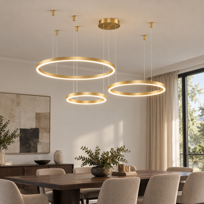 Gold three-ring LED chandelier with 80, 60 and 40 cm rings, side view installed above a dining table