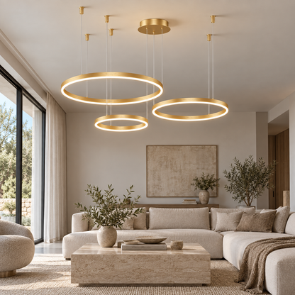 Gold three-ring LED chandelier with 80, 60 and 40 cm rings, front view installed in a living room