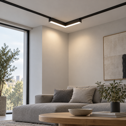 Black corner magnetic floodlight installed in a recessed ceiling track above a living room