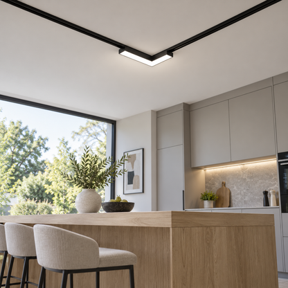 Underside view of an illuminated corner track light in a modern kitchen