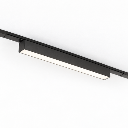 Black 23 cm linear LED module and matching surface rail on a pure white background