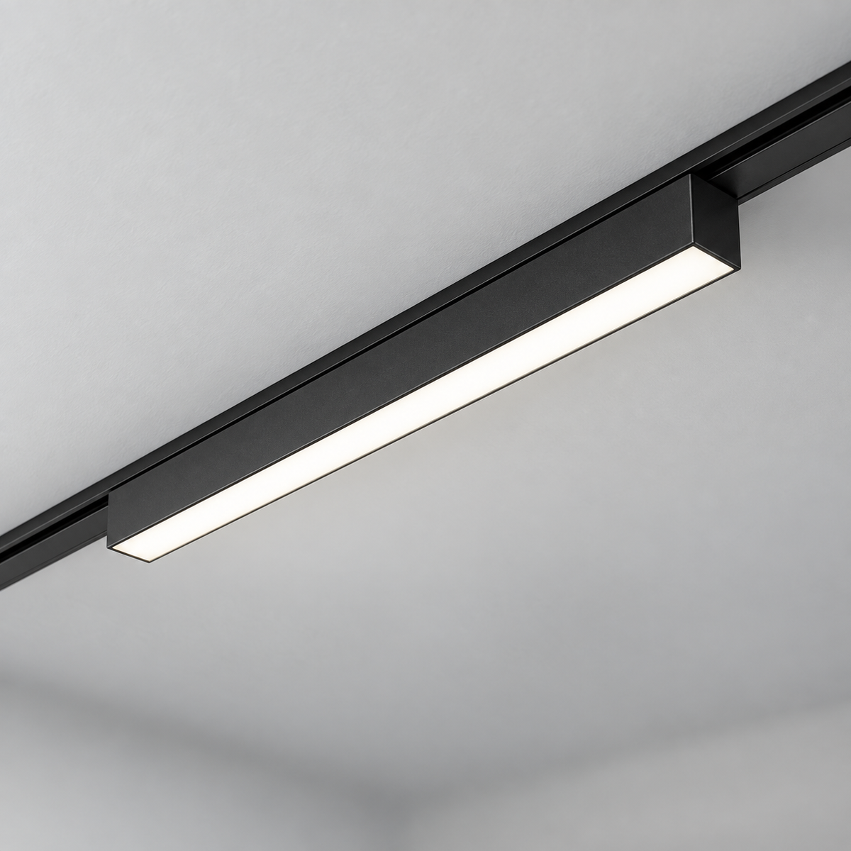 Centred black 23 cm linear LED module installed in a matching ultra-thin rail