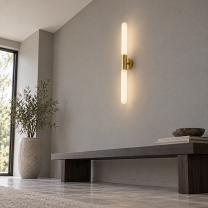 Low-angle view of a frosted white glass rod wall light in a hallway