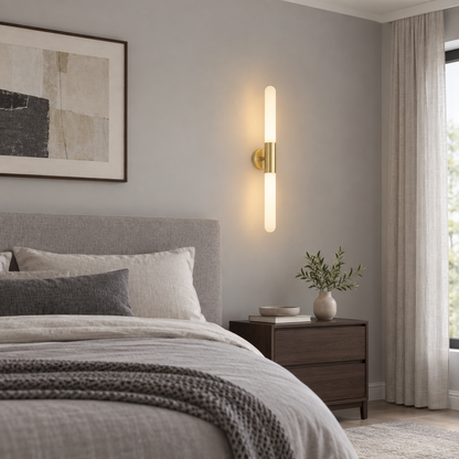 Frosted white glass rod LED wall lamp installed beside a contemporary bed