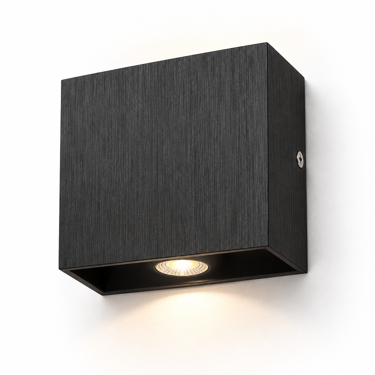 Black brushed aluminium square wall light on white, with a shallow rectangular body and recessed circular LED
