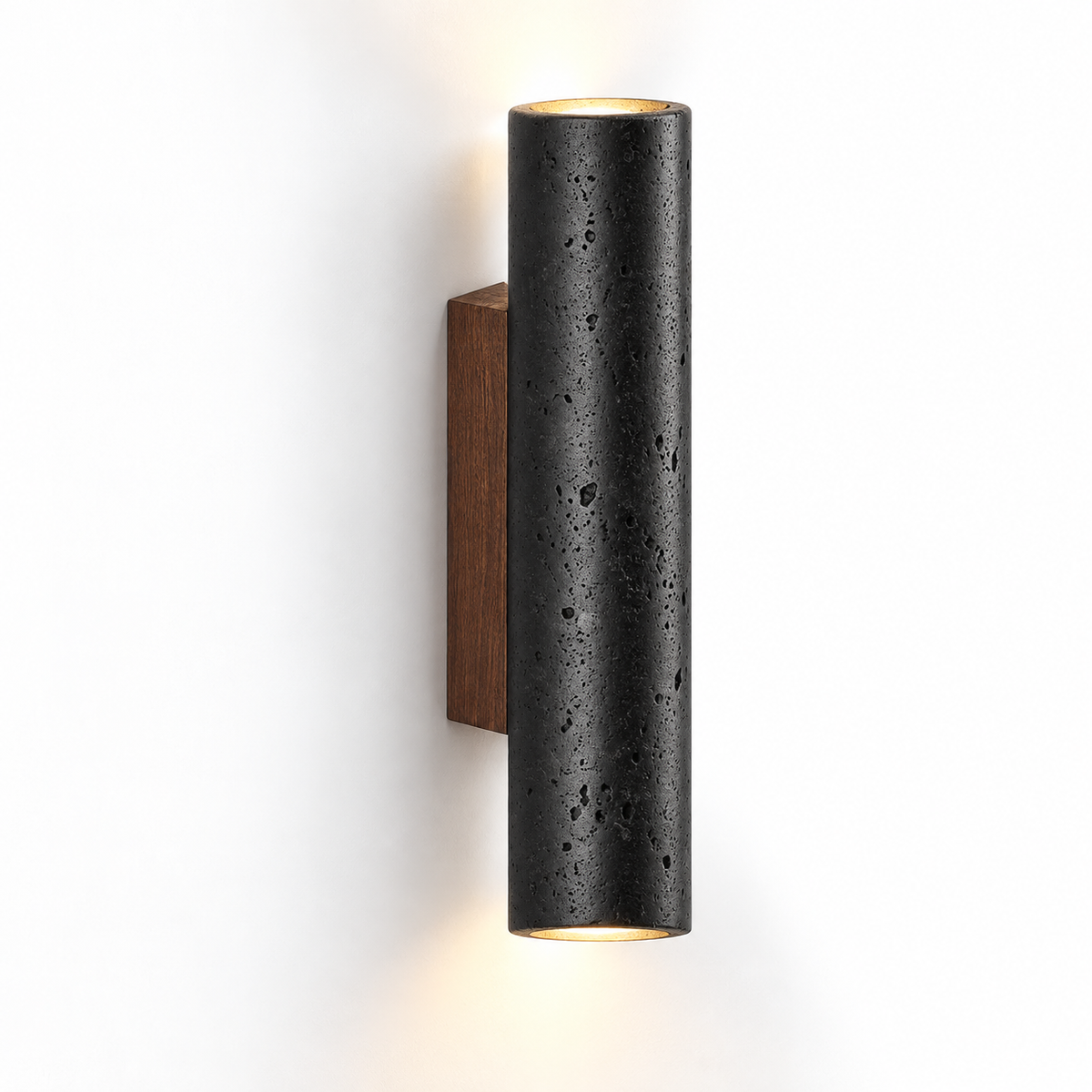 Black cylindrical travertine wall light, 32 cm high, on a pure white background