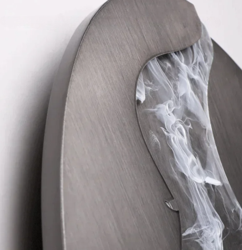 Abstract face wall sconce