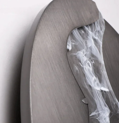 Abstract face wall sconce