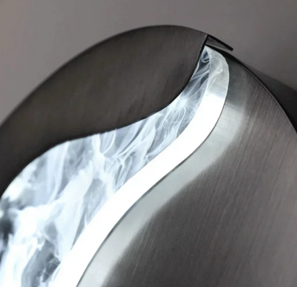 Abstract face wall sconce