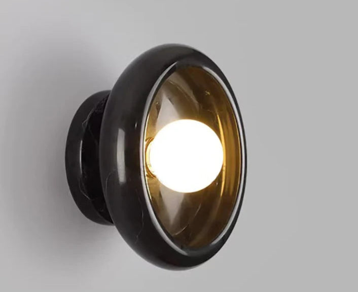 Black marble Jade Wall Lamp turned on, providing bold contrast and soft LED glow for modern and luxurious interior lighting.