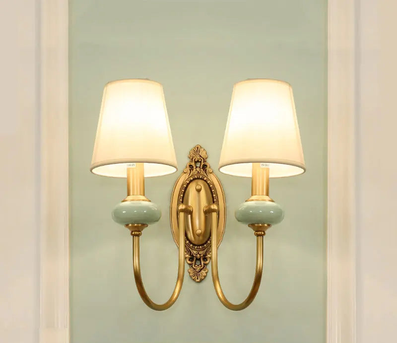 Dual-arm copper wall lamp LED sconce with fabric shades, perfect for hotel or office lighting with a vintage modern aesthetic.