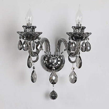 Dark chrome vintage lotus wall sconce with clear LED bulbs and crystal drops, ideal for sophisticated home lighting.