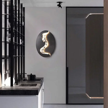 Abstract face wall sconce