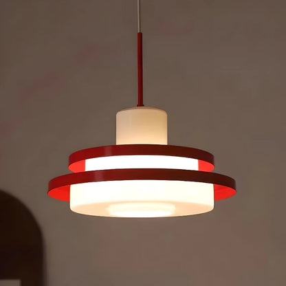 Modern vintage light fixture illuminated in a dim room, highlighting the warm glow of the Nordic Retro LED Chandelier.