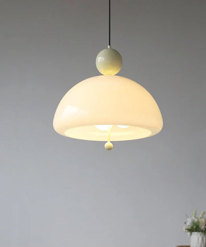 Cream-colored Medieval Pendant Light with soft glow and minimalist top, perfect for cozy and elegant home lighting.