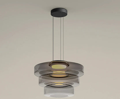 Smoke grey three-tier glass pendant light with LED. Elegant and modern, perfect for upscale kitchen or dining room lighting.