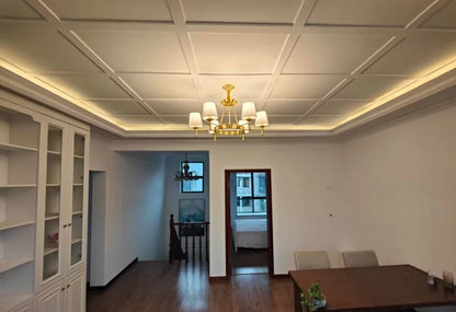 Koperen kroonluchter met stoffen lampenkappen