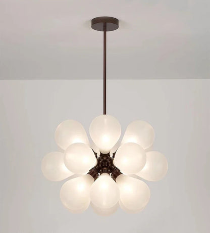 White Scandinavian chandelier with black lampbody, featuring frosted glass bubbles for a soft, elegant lighting effect.