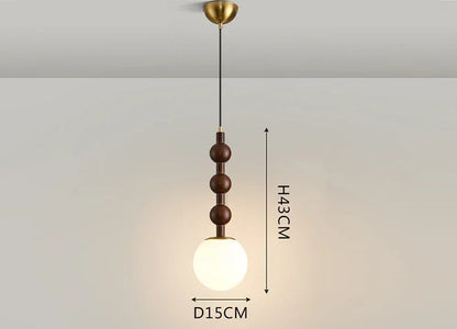 Minimalist Nordic Pendant Light with frosted glass globe and wood stem, ideal for LED lighting in compact spaces.