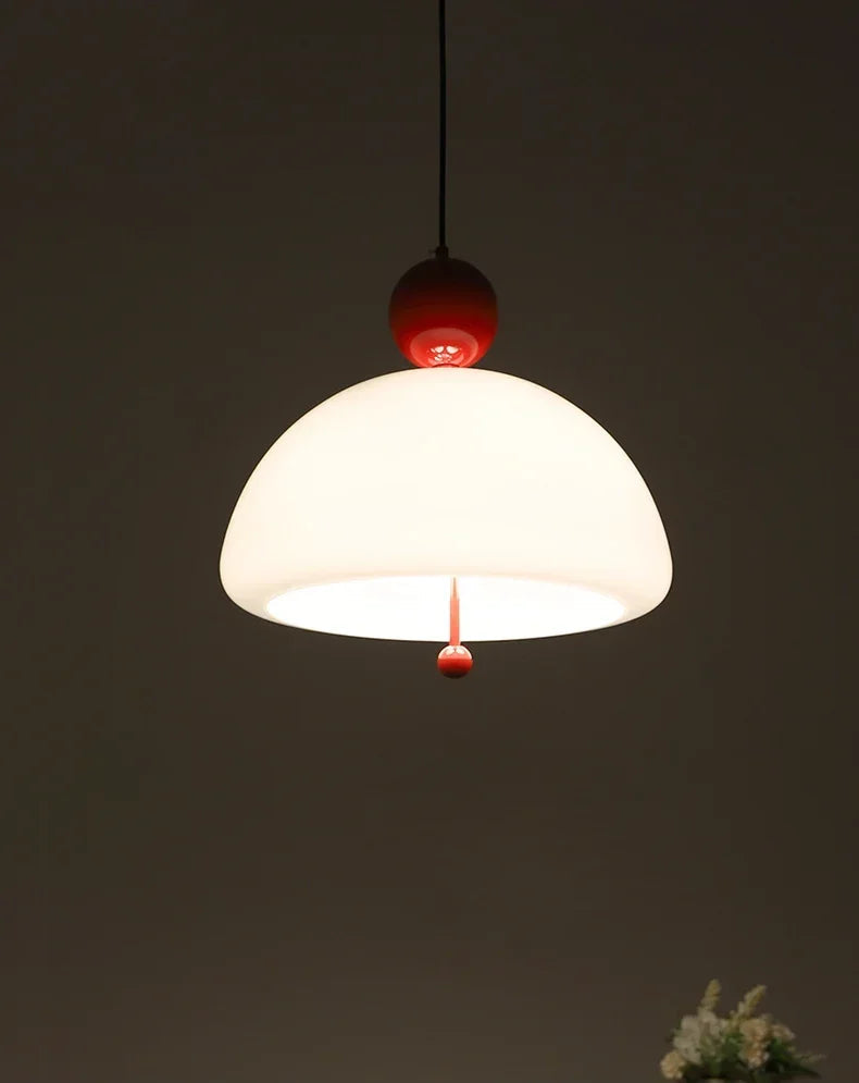 Warmly lit Medieval Pendant Light with red accent, ideal for creating a vintage ambiance in living or dining areas.