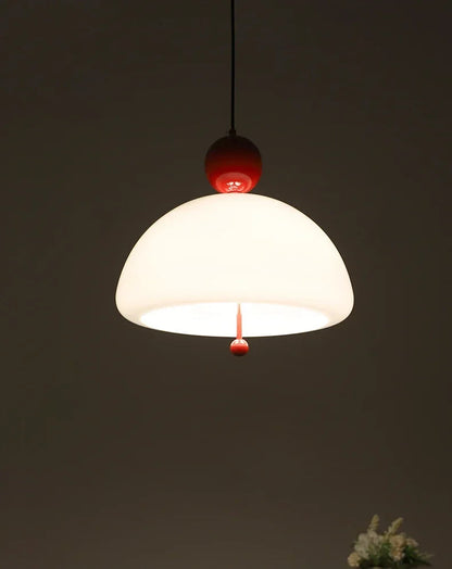 Warmly lit Medieval Pendant Light with red accent, ideal for creating a vintage ambiance in living or dining areas.