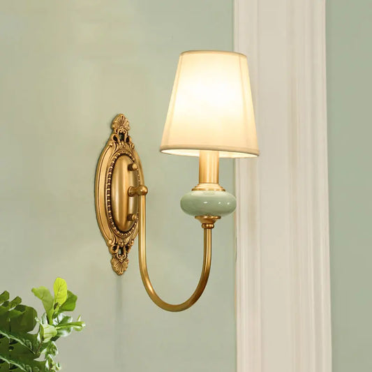 Copper wall lamp LED sconce with vintage curved arm and fabric shade, ideal for bedroom or stairway lighting in classic interiors.