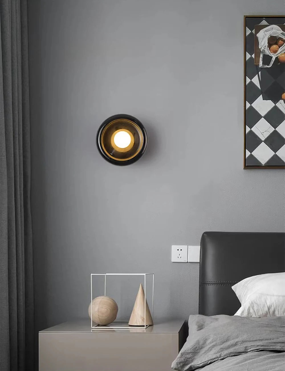 Black marble Jade Wall Lamp above a nightstand, blending modern design and ambient lighting for stylish bedroom decor.