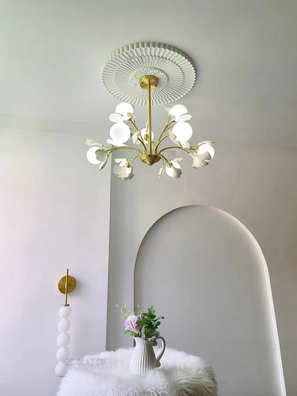 Modern dining room pendant light with floral LED bulbs, mounted on ornate ceiling medallion, adding elegance to interior decor.