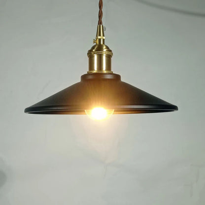 Black Industrial Brass Pendant Light with warm glow, ideal for modern bar lighting or vintage home ambiance.