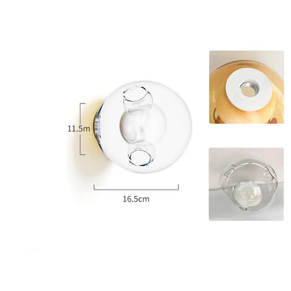 Clear glass LED wall sconce with Italian design, offering a clean and modern lighting solution for bedrooms or cafés.