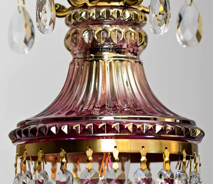 Detailed view of red fluted glass and crystal trim on luxury French chandelier, retro pendant light for refined spaces.