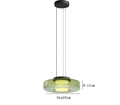 Green glass pendant light with 35cm diameter and 11cm height. LED lighting and adjustable hanging for modern interiors.