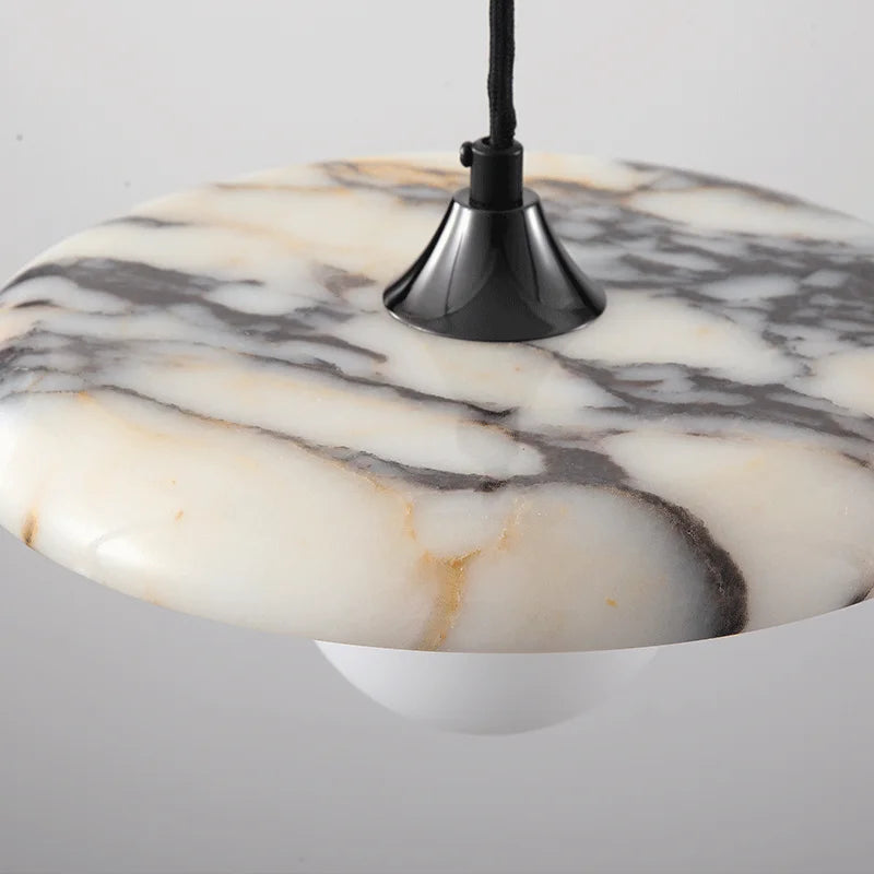 Close-up of the Marble Pendant Light’s black LED chandelier top, showcasing the natural veining and polished finish of the marble shade.