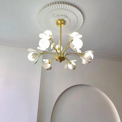 Modern pendant light fixture with soft white illumination and floral design, perfect for contemporary dining or bedroom interiors.