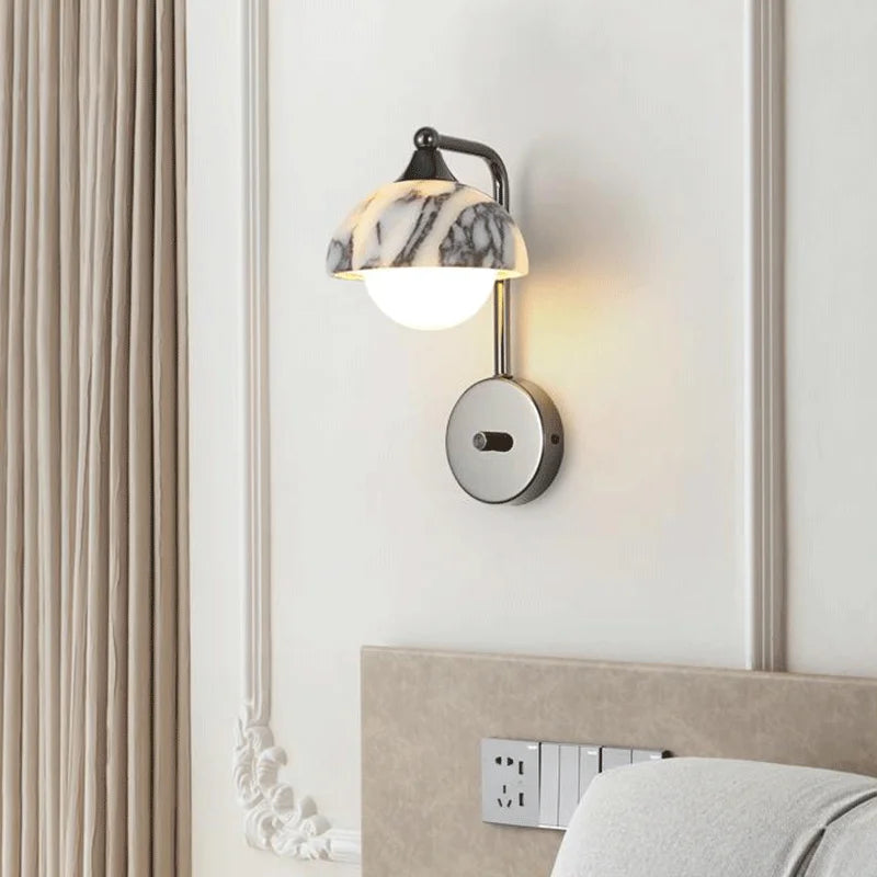 Stone light wall sconce with alabaster shade mounted in a stylish bedroom, offering warm LED illumination and decorative appeal.