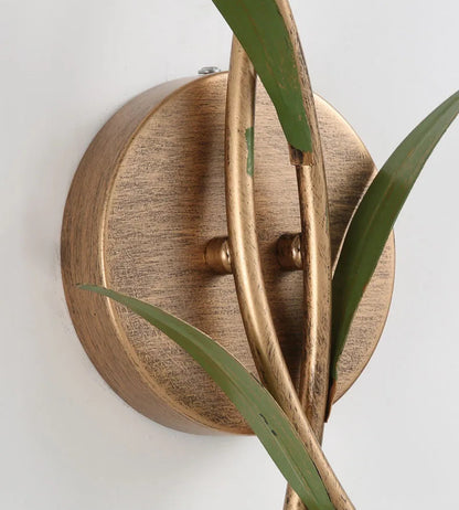 Close-up of French Pastoral Wall Lamp's brass base and intertwined stem design, showcasing vintage craftsmanship and detail.