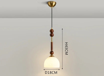 Compact Nordic Pendant Light with glass globe and wood stem, ideal for LED lighting in bedrooms or counters.