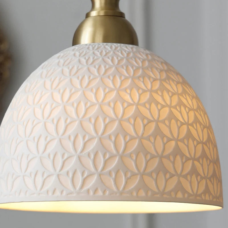 Detailed view of the cream ceramic shade on the French Modern Chandelier, highlighting the retro floral pattern and warm glow.
