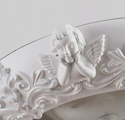 Angel detail on carved plaster chandelier - french farmhouse ceiling light, adding charm and elegance to vintage lighting.