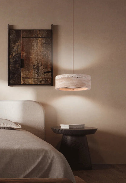 Travertine Retro Pendant Light illuminating a bedside table, blending modern design with natural materials for cozy bedroom lighting.