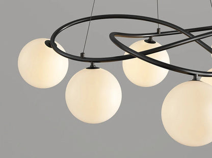 Close-up of black frame LED Chandelier with glowing globe bulbs, highlighting modern craftsmanship and soft lighting effect.