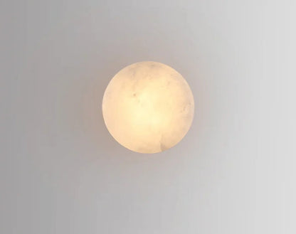 Glowing circular Modern LED Marble Wall Lamp viewed from the front, ideal for soft ambient lighting in any room.