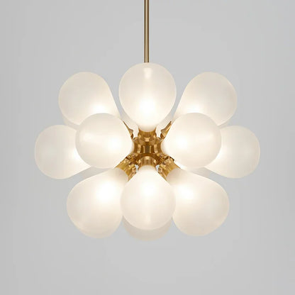 White bubble glass chandelier in Scandinavian style with gold finish, ideal for soft ambient lighting in modern spaces.