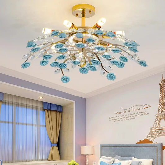 French ceramic flower chandelier with blue roses and crystal accents, modern ceiling light for bedroom decor in gold finish.