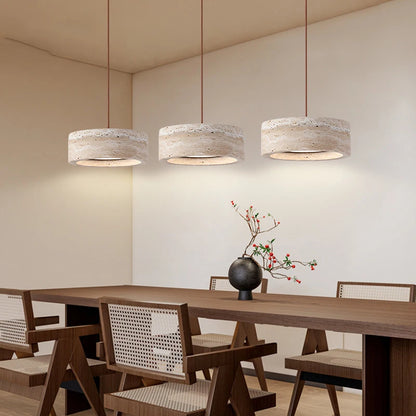 Travertine Stone LED Pendant Light – Modern Fixture shown in a dining room with three cylindrical lights above a wooden table and chairs.
