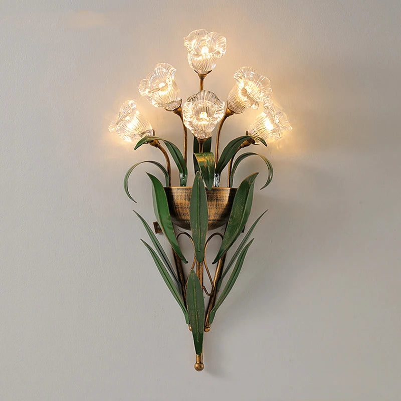 French country wall light with clear flower-shaped bulbs and green leaves, ideal for vintage-inspired home lighting.